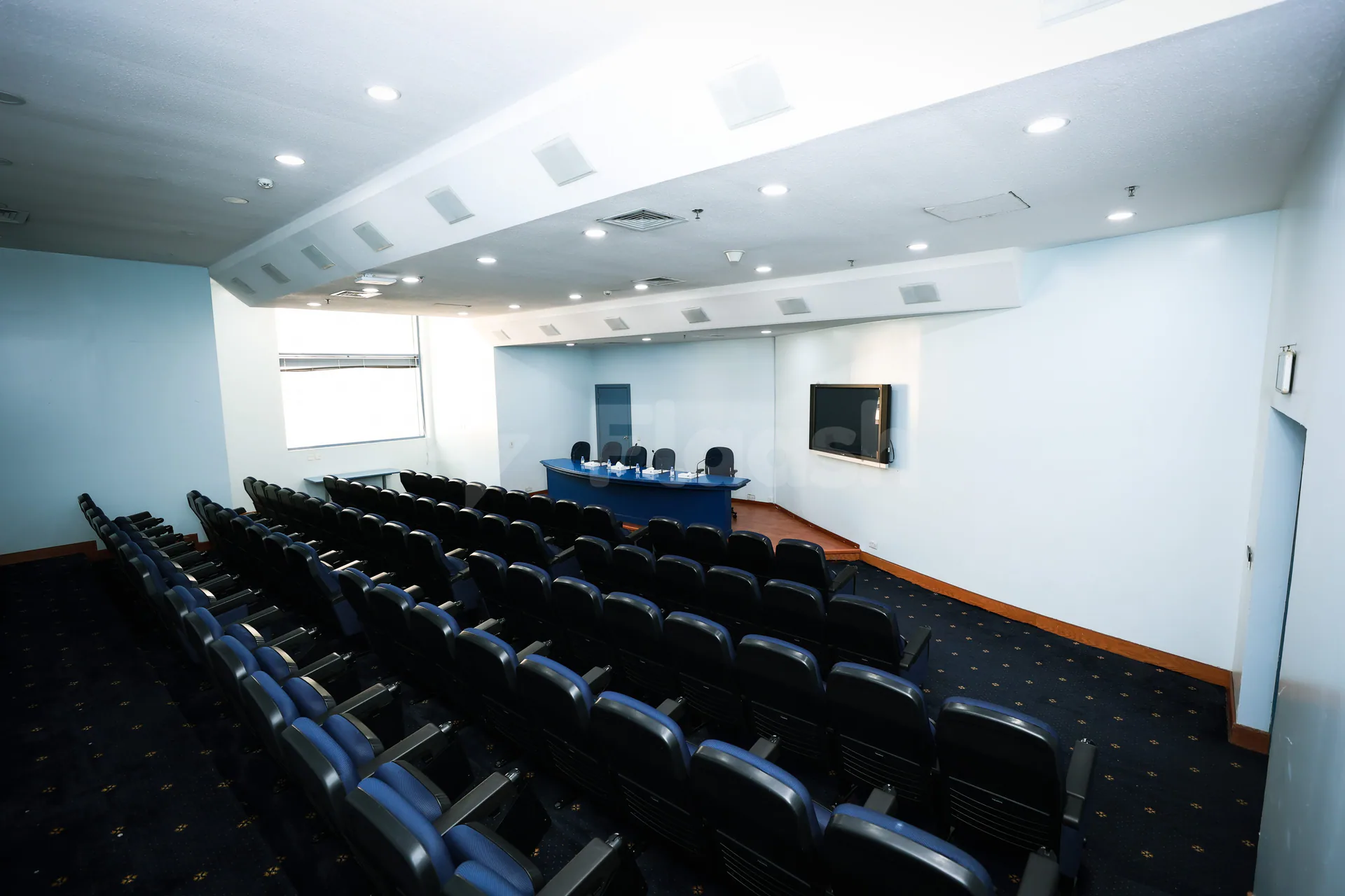 Meeting Room at Jeddah International Exhibition & Convention Center featuring rows of chairs facing a blue conference table