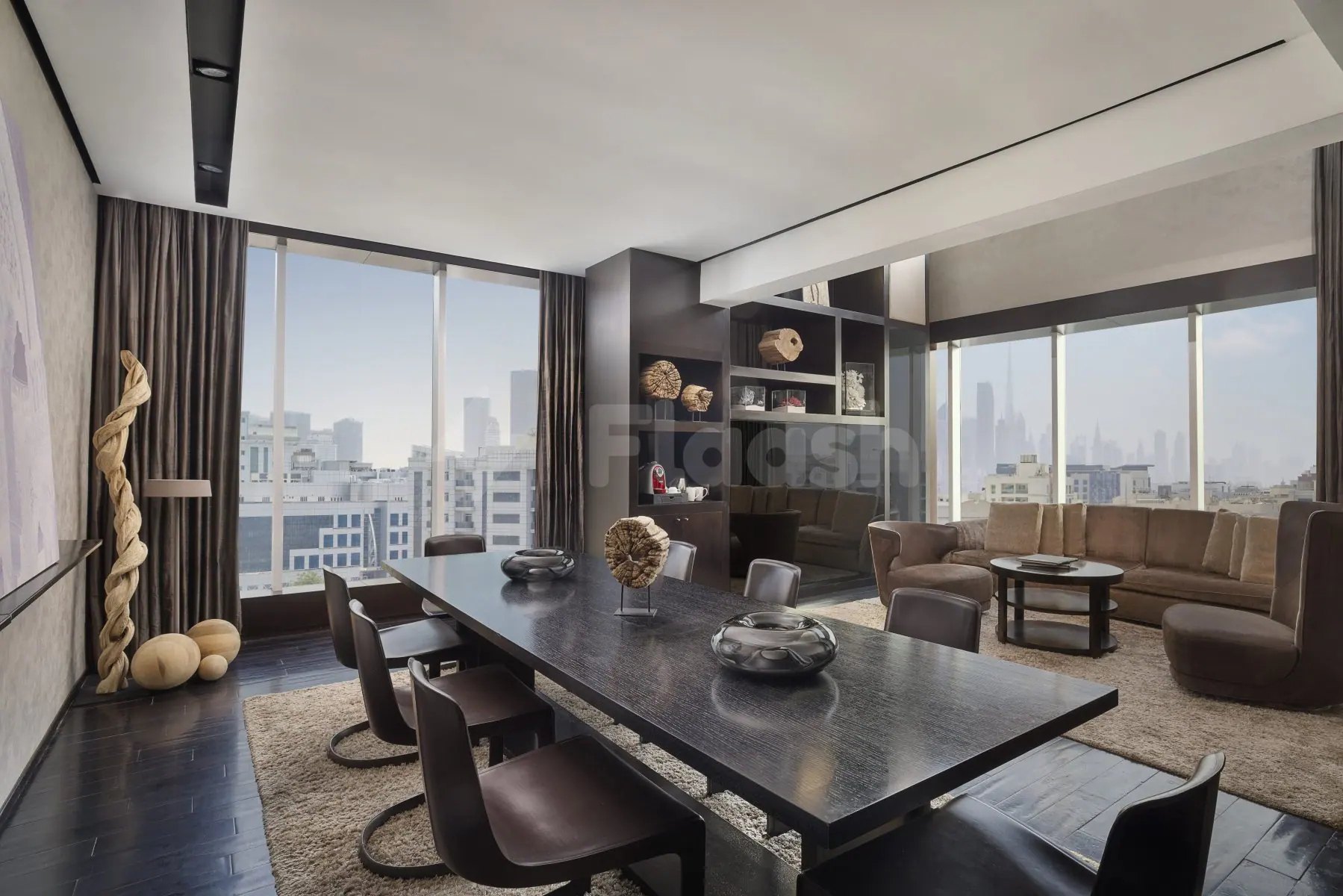 Boardroom at Signature by Sanjeev Kapoor Restaurant Dubai with long dark table, black chairs, and floor-to-ceiling windows