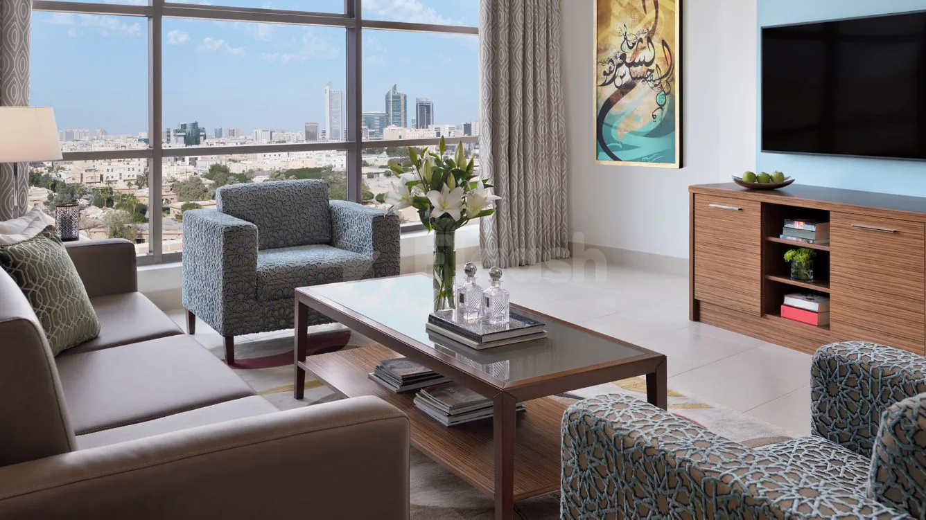Meeting room at Marriott Executive Apartments Al Khobar with floor-to-ceiling windows overlooking the city skyline