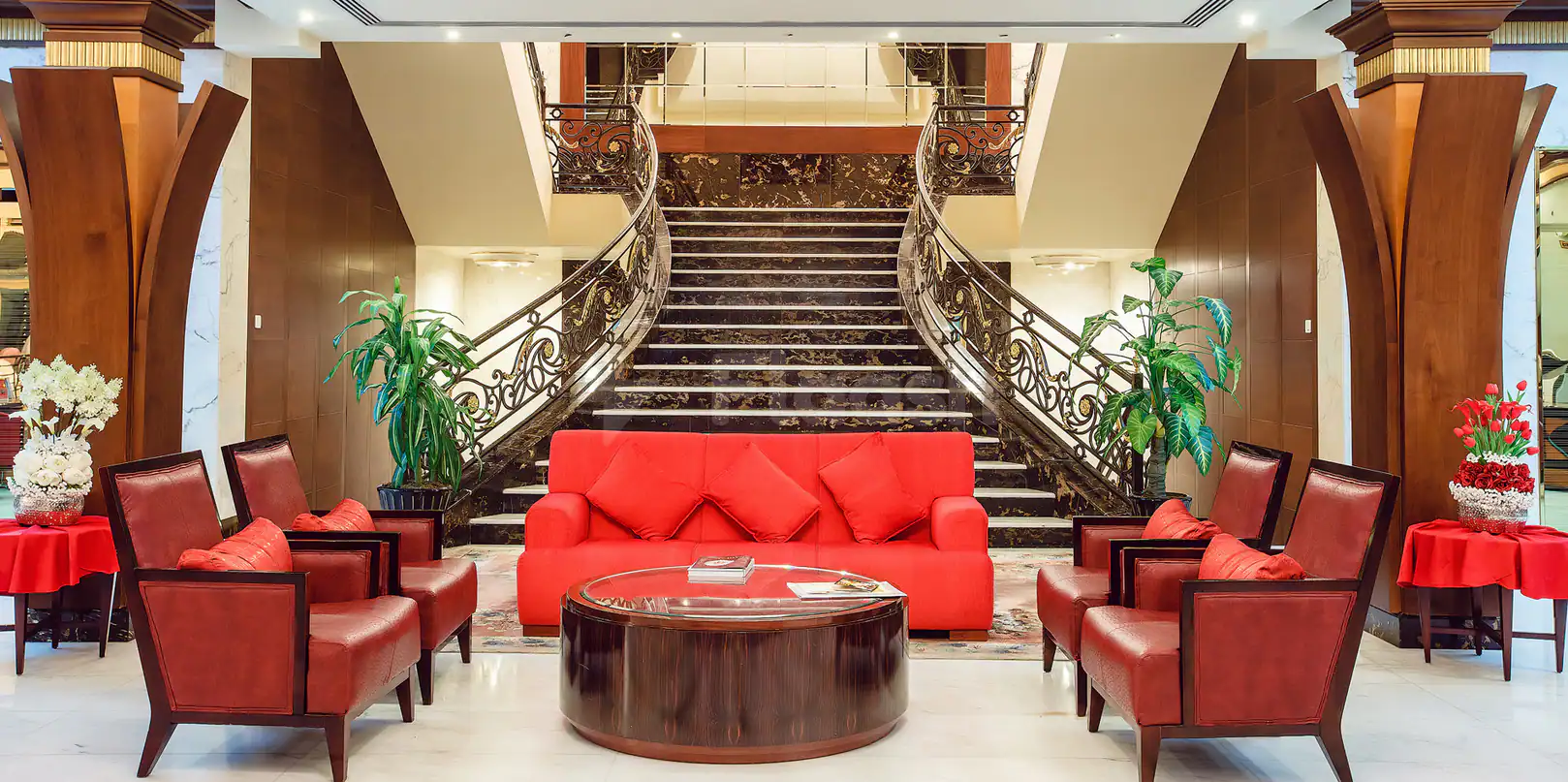 Grand staircase at Sahara Beach Resort & Spa in Sharjah with ornate wrought iron railing