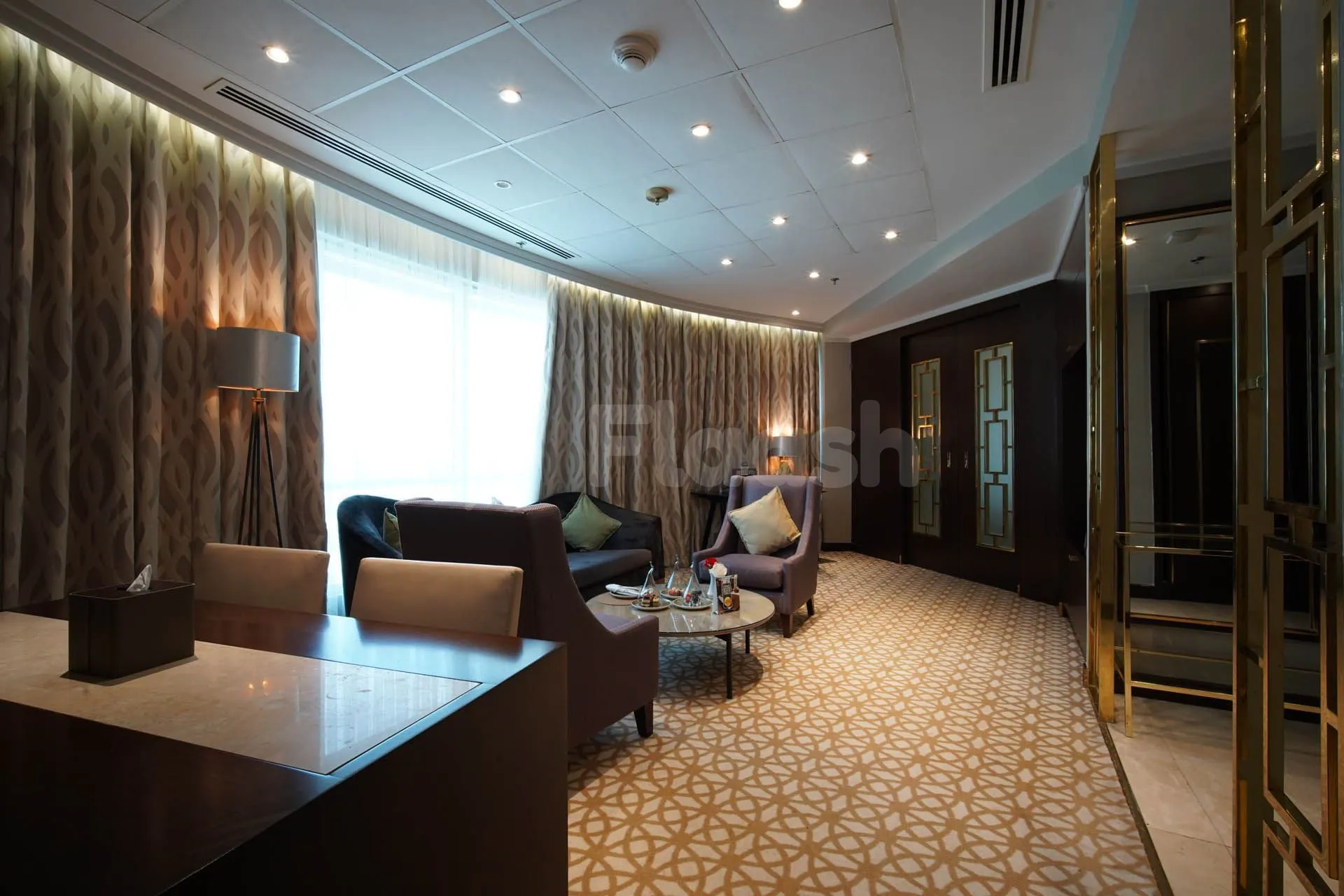 Meeting room at Time Rako Hotel Qatar in Doha with patterned carpet and gold-accented double doors