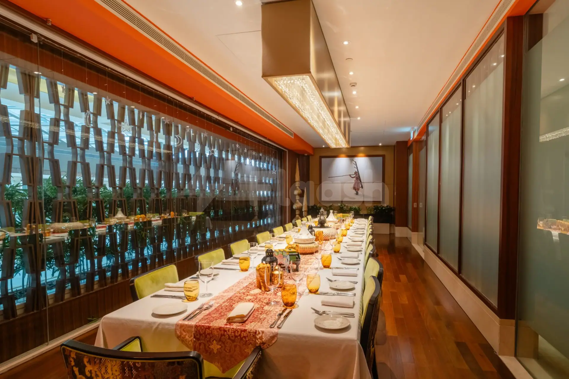 Long dining table at Namak Restaurant Abu Dhabi with hanging star decorations
