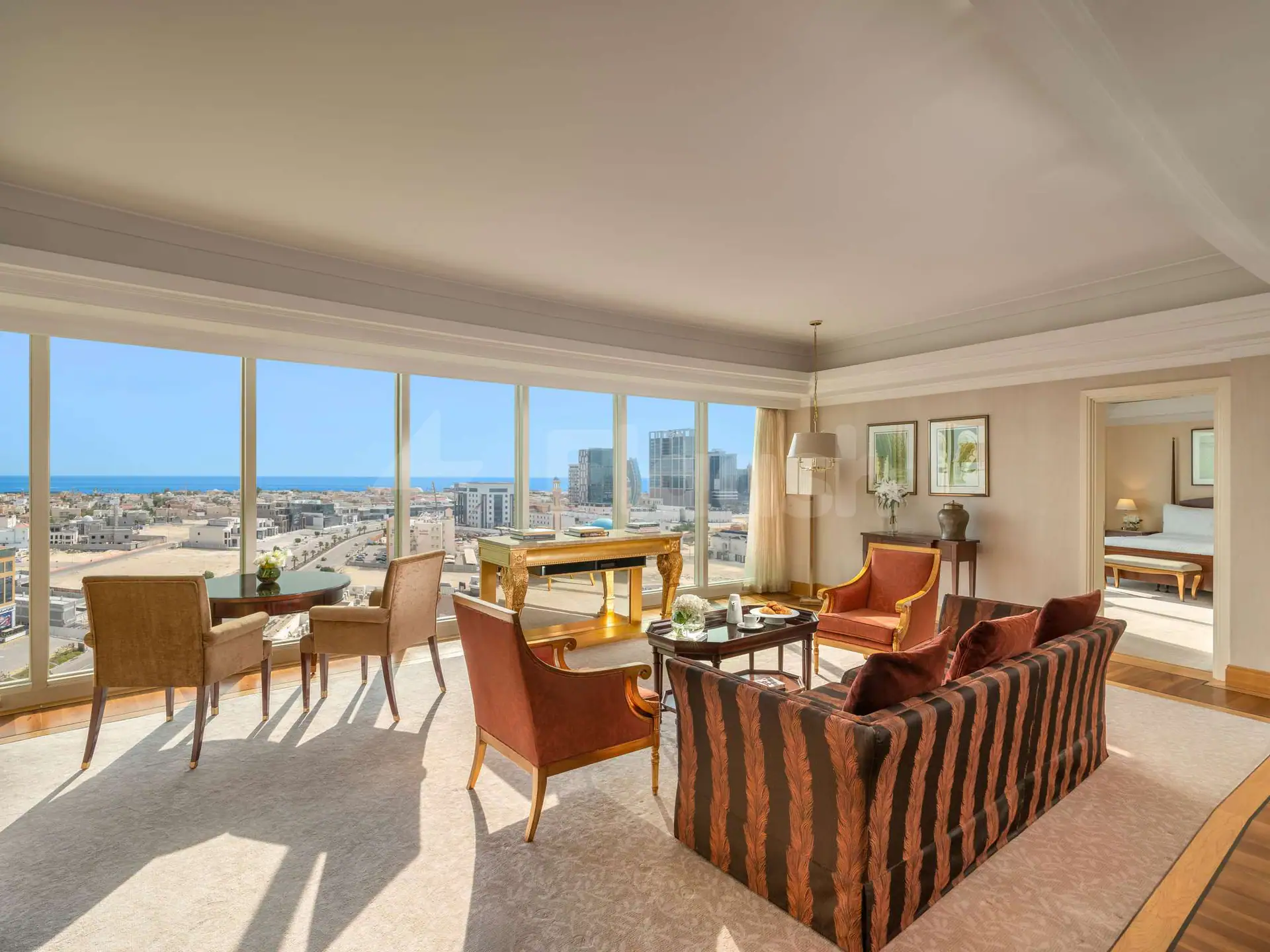 Meeting room at Movenpick Hotel AlKhobar Dammam with floor-to-ceiling windows overlooking the city and ocean