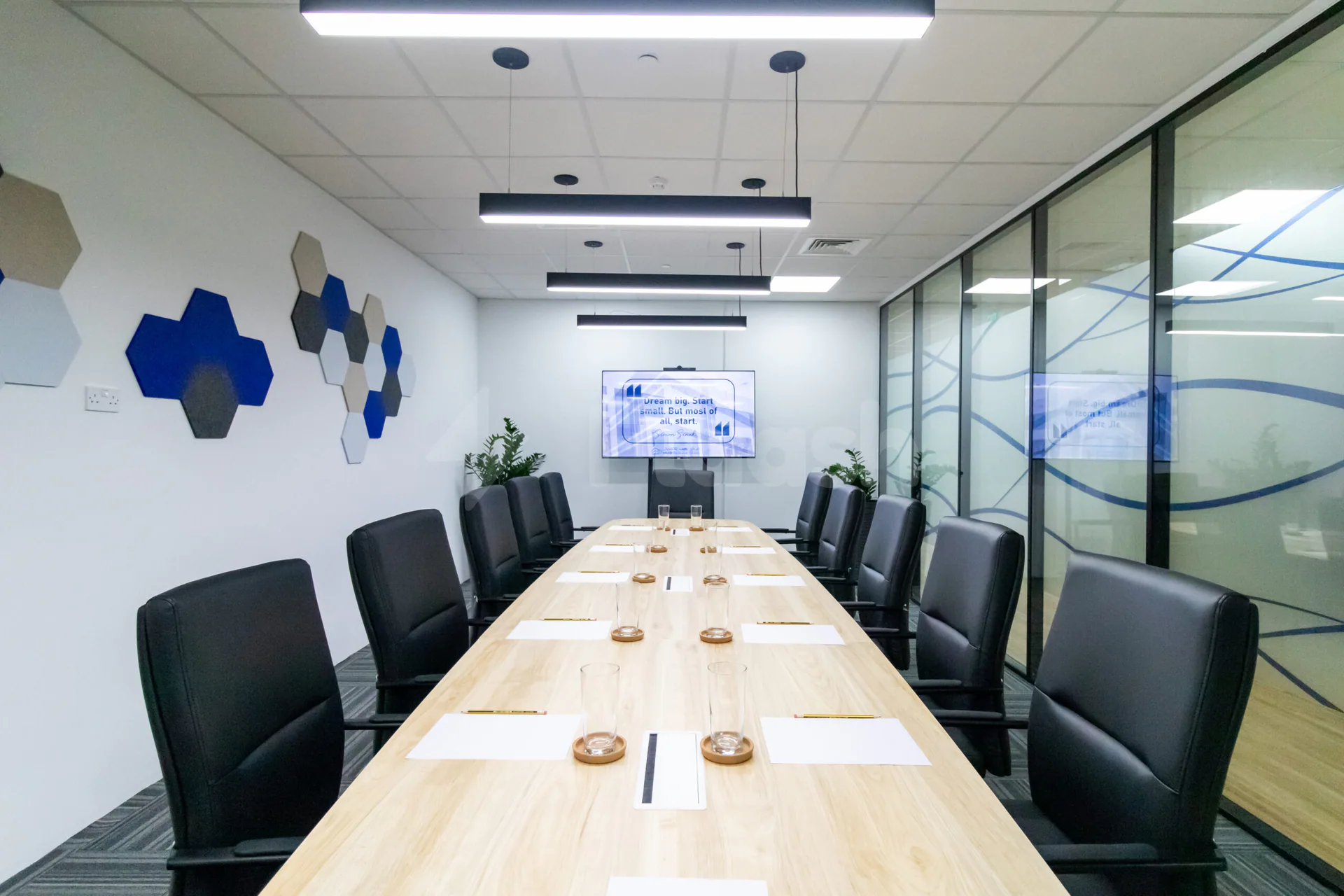 Boardroom at Hub Business Center Burj Marina Lusail with hexagonal wall art