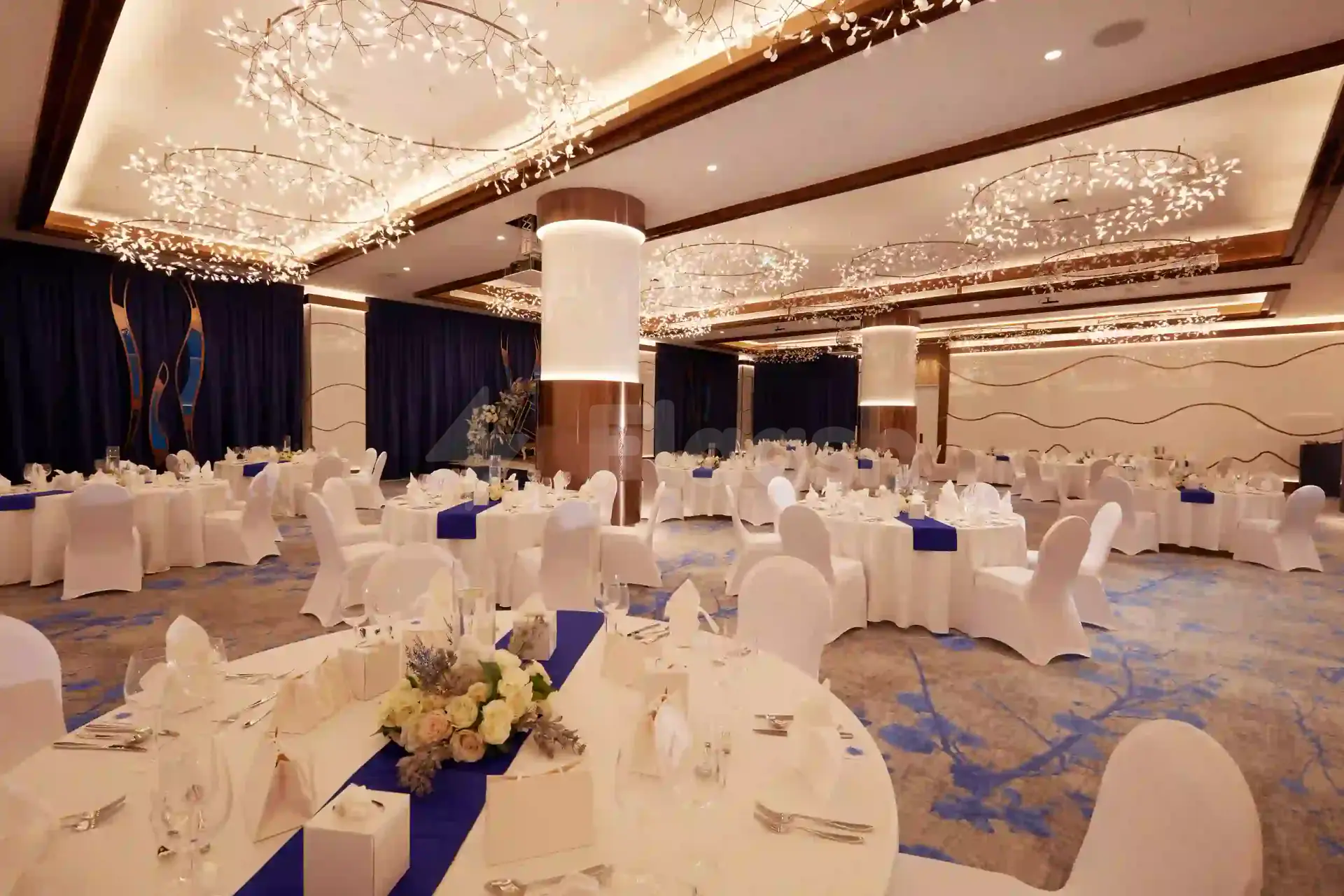 Ballroom at Royal M Hotel & Resort Al Aqah Beach Fujairah with circular ceiling lights and white pillars
