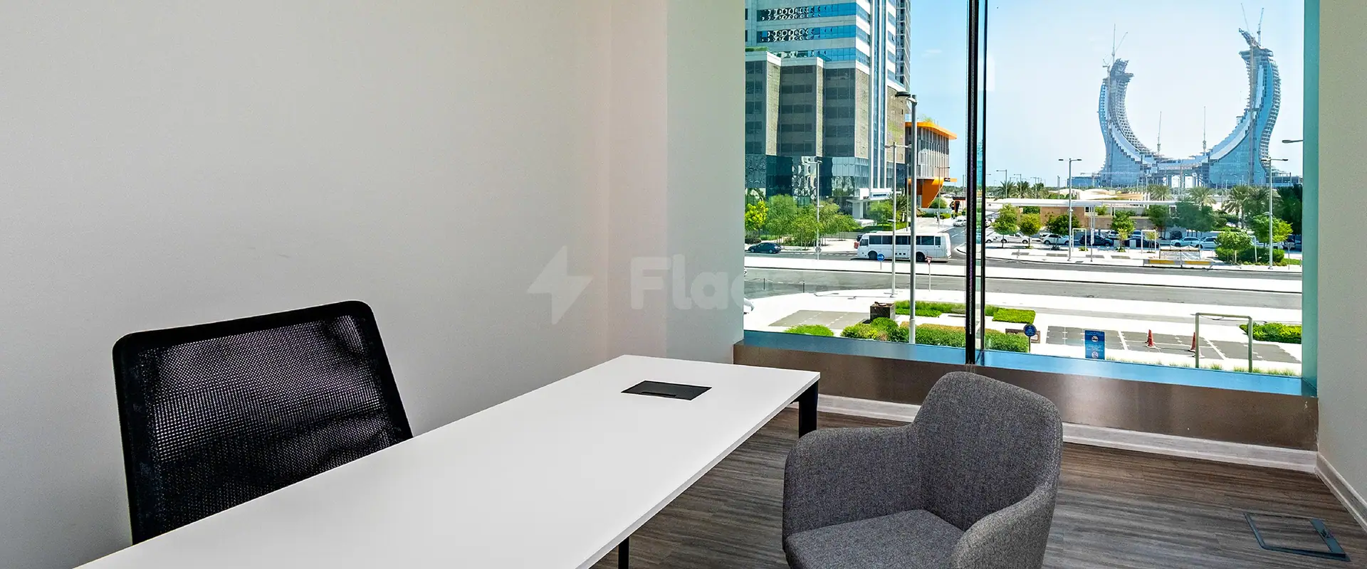 Meeting room at Nestwork Burj Alfardan Lusail in Lusail with large window overlooking city skyline