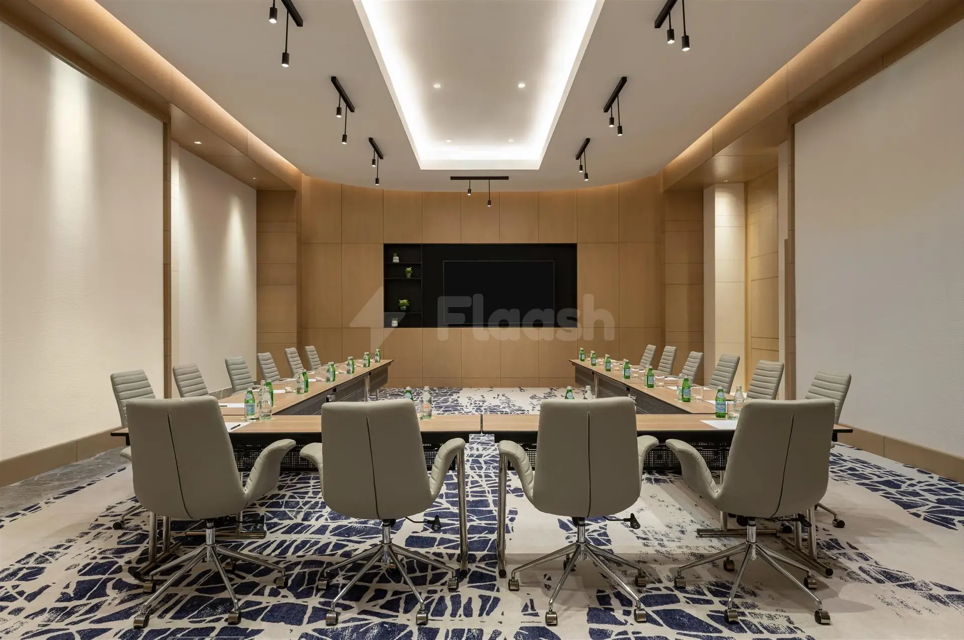 Boardroom at Le Royal Méridien Place Vendôme Lusail, Lusail, with wooden paneling and blue patterned carpeting