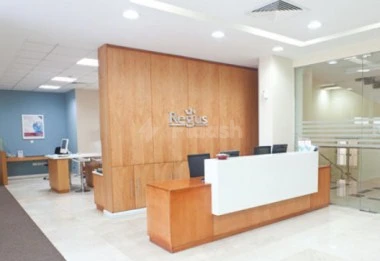 Reception area at Regus - Doha Airport, Doha, featuring wooden paneling and glass partitions