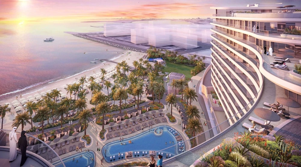 Rooftop terrace at Waldorf Astoria Doha Lusail, Lusail – Doha, with infinity pools and palm-lined beach views at sunset