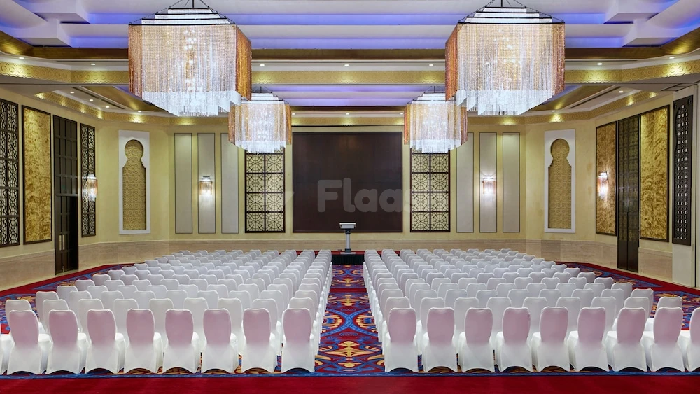 Ballroom at Intercontinental Doha Beach & Spa, Qatar, with crystal chandeliers and patterned carpet