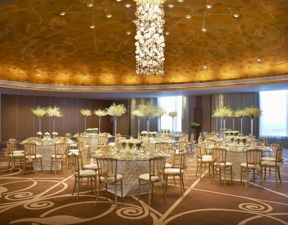 Ballroom at W Doha, Doha, with crystal chandelier and patterned carpeting