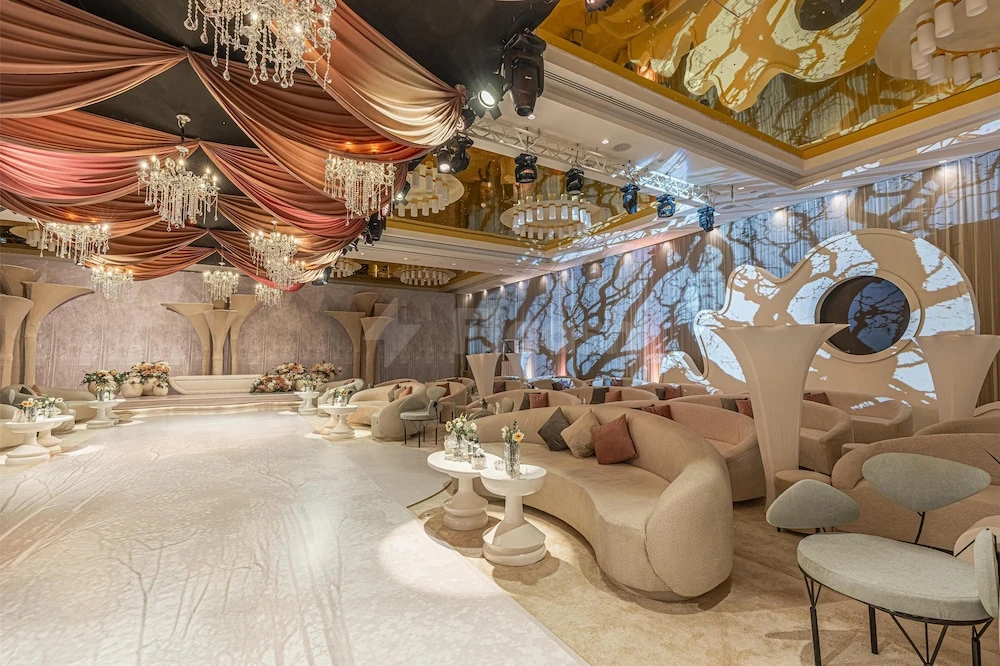 Luxurious event space at Radisson Blu Hotel and Residence Riyadh D.Q., Riyadh, with elegant drapery and chandeliers