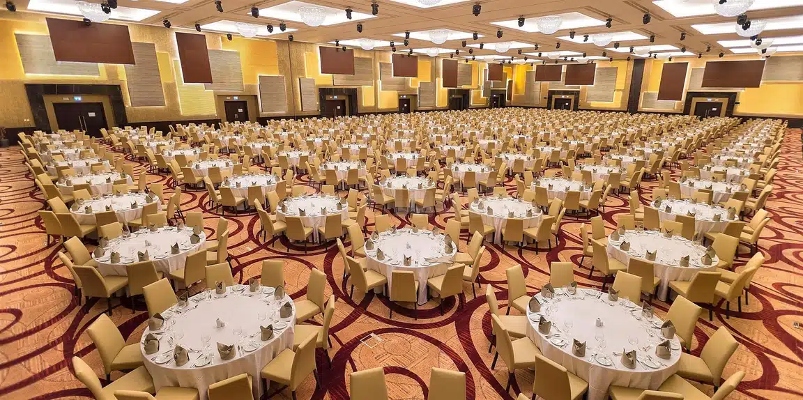Banquet hall 32 tables set for event at Crowne Plaza Riyadh RDC Hotel & Conventionvention, Riyad, with patterned carpet
