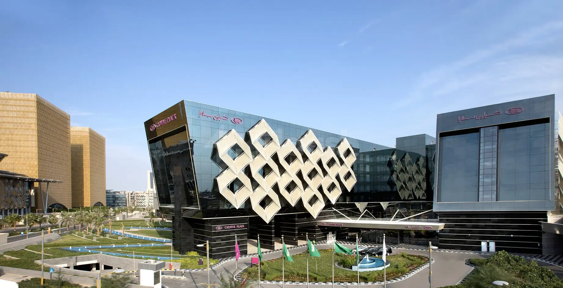 Modern facade at Crowne Plaza Riyadh RDC Hotel & Convention, Riyadh, featuring geometric diamond patterns on glass exterior