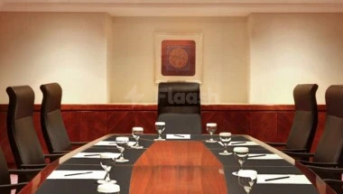 Boardroom at Le Méridien Towers Makk9, Makkah, featuringinha, with wooden table and leather chairs arranged symmetric
