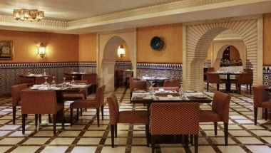 Dedicated dining space 5-star hotel restaurant at Le Méridien Towers Makkah, Makkah4,, with arched alcoves and patterned