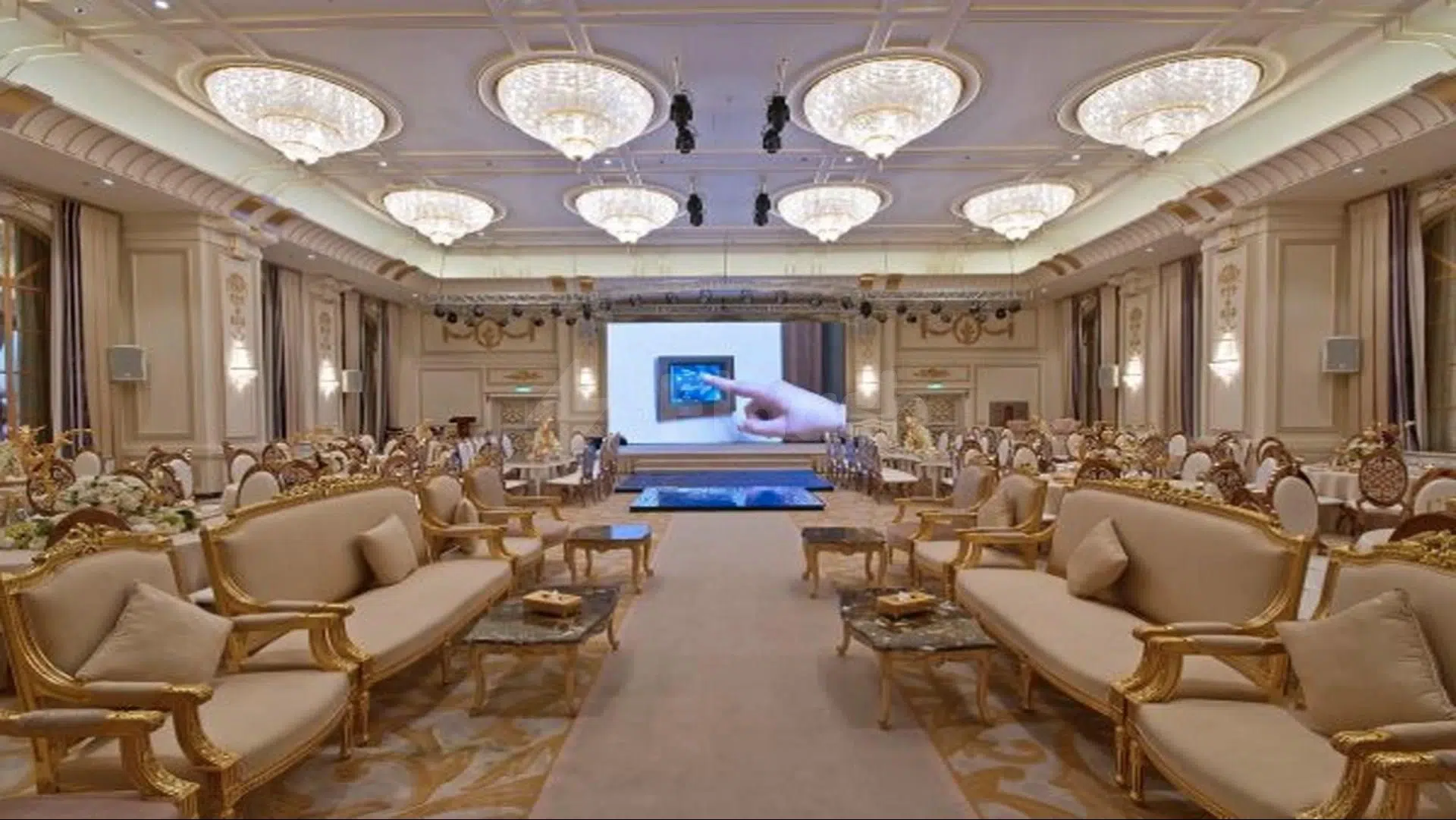Grand ballroom at Casablanca Grand Hotel, Jeddah, features gilded furniture and crystal chandeliers above a central stage