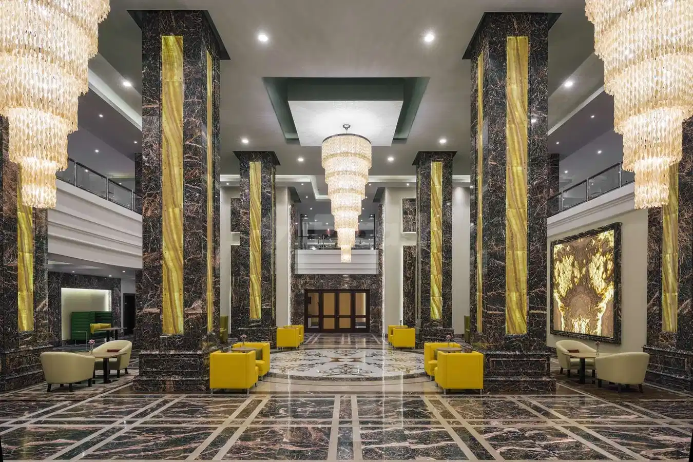 Grand lobby at Park Inn by Radisson, Makkah Al Naseem, Mecca, featuring marble columns with gold accents