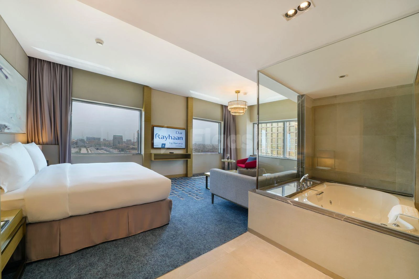 Luxury suite at Dar Rayhaan by Rotana Al Khobar, Al Khobar, featuring city view and glass- partitioned bathtub