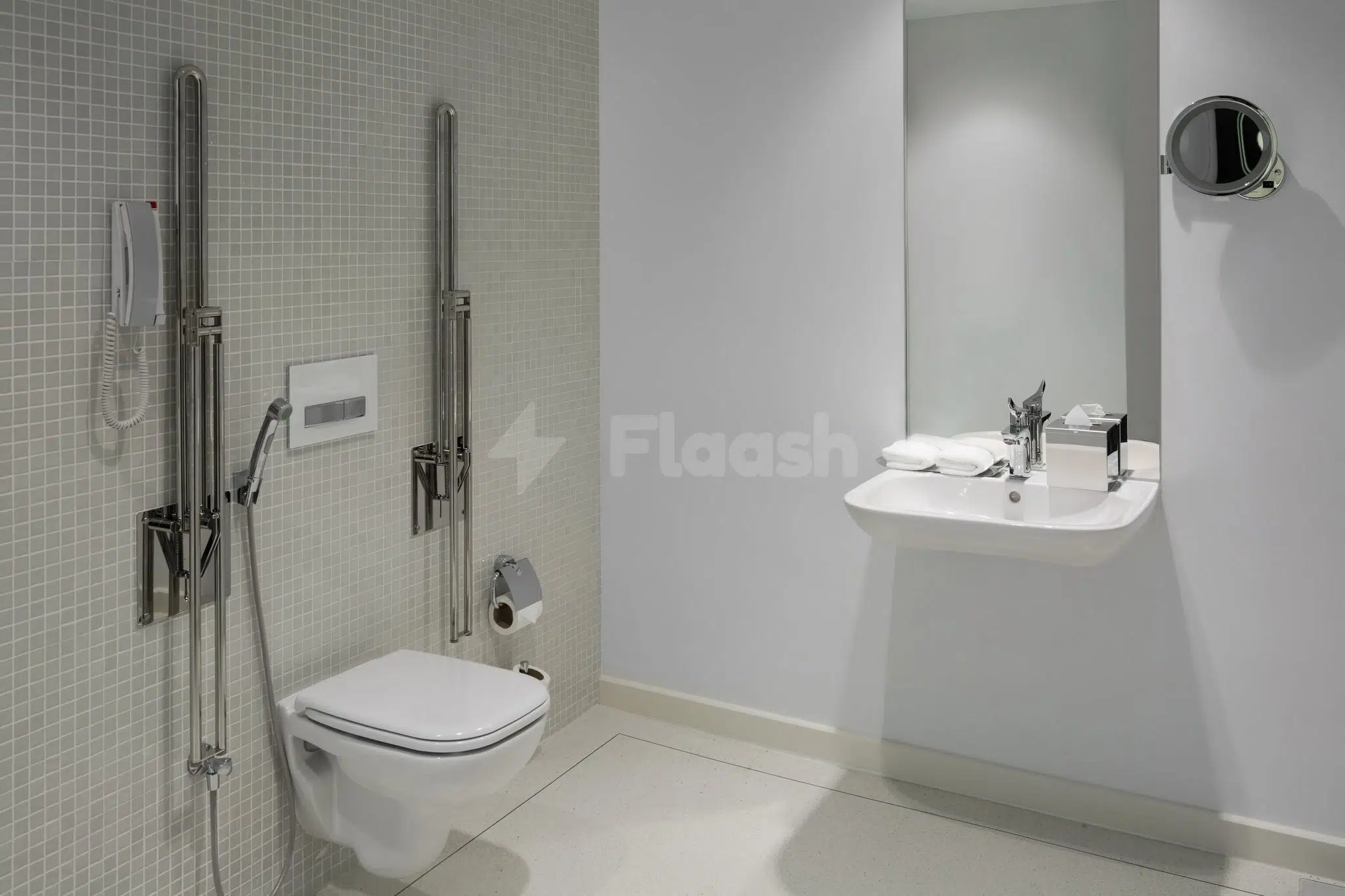 Bathroom at Staybridge Suites Al Khobar, Al-Khobar, featuring wall-mounted toilet and chrome shower fixtures