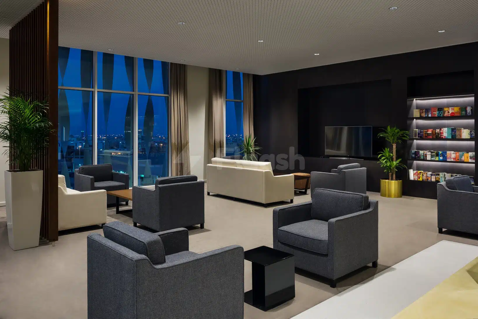 Lounge area at Staybridge Suites Al Khobar, Alepend, Al-Khobar, with cityscape views through large windows and modern seating