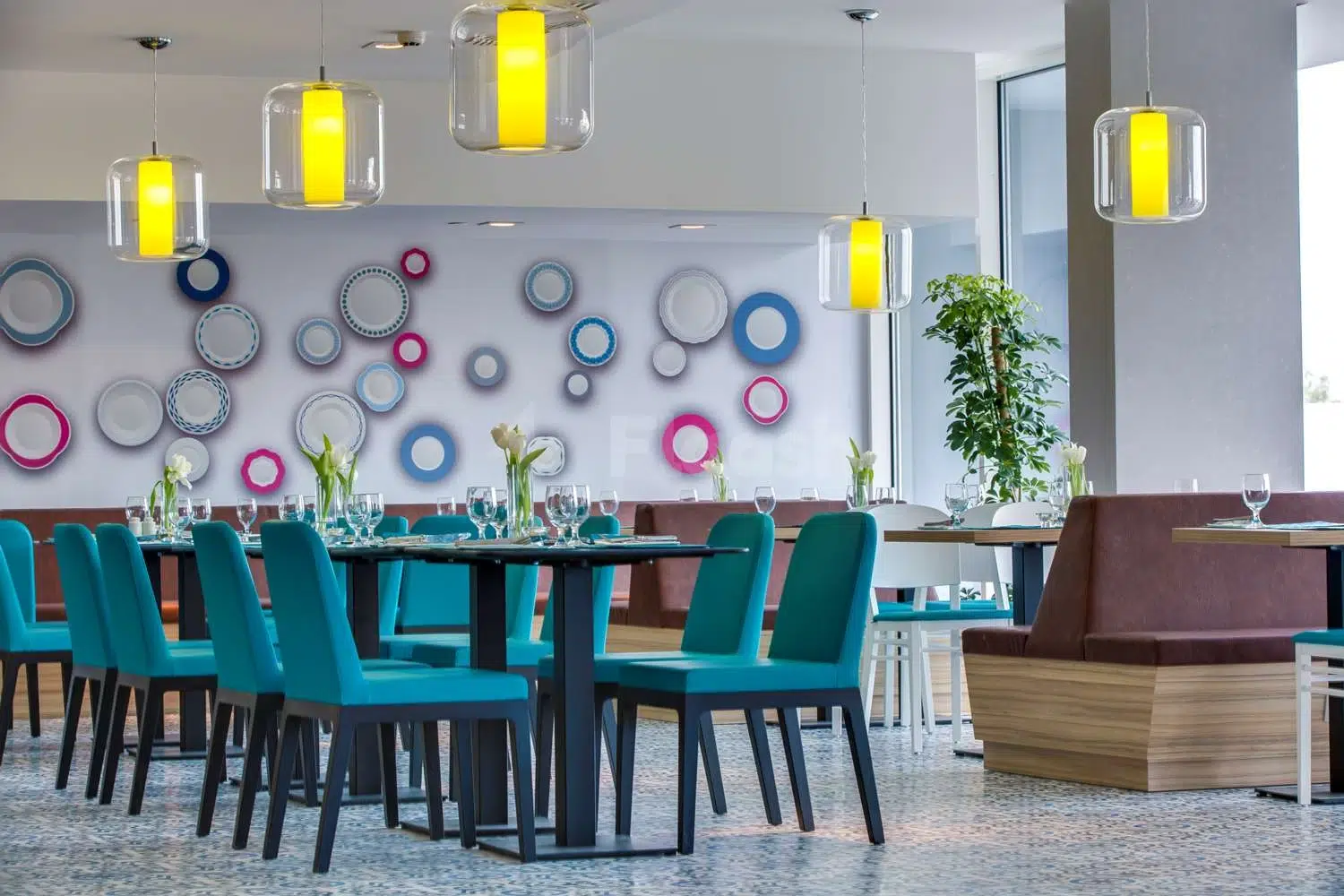Dining area at Park Inn by Radisson Dammam, Dammam, with colorful plate wall decor