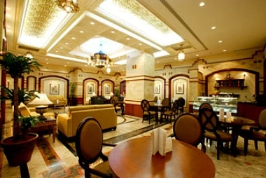 Lobby lounge at Le Méridien Makkah, Makkah, with ornate ceiling lights and patterned marble floors