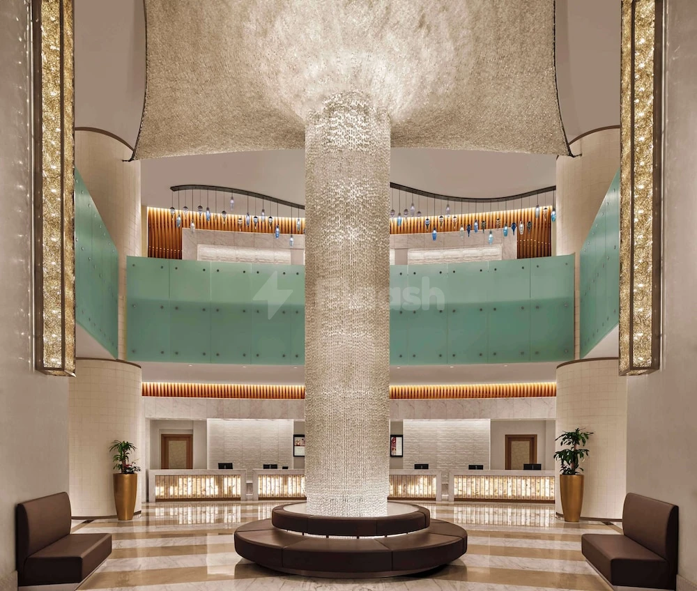 Grand lobby at Hilton Hotel & Convention Jabal Omar Makkah, with crystal column and teal glass balustrades