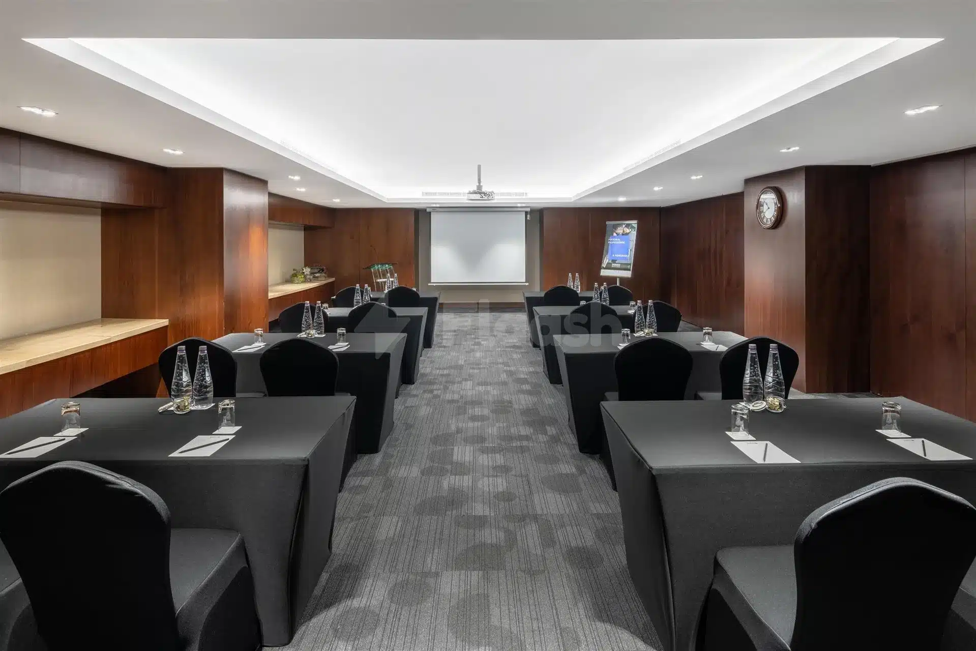 Conference room at Radisson Blu Hotel, Jeddah Al Salam, with dark wood paneling and recessed ceiling lights