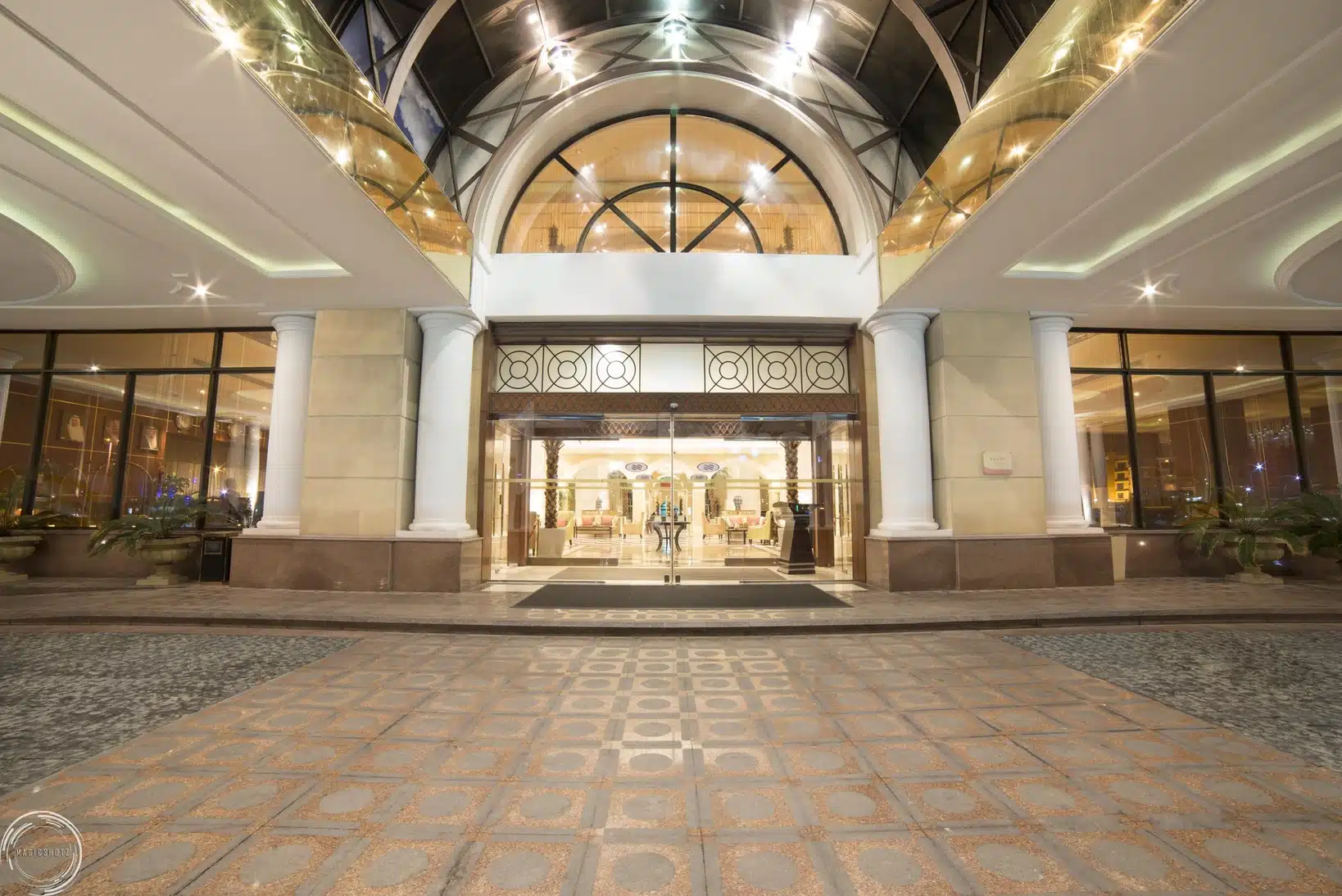 Grand entrance at Crowne Plaza Al Khobar, Al Khobar, featuring arched glass ceiling and fluted columns