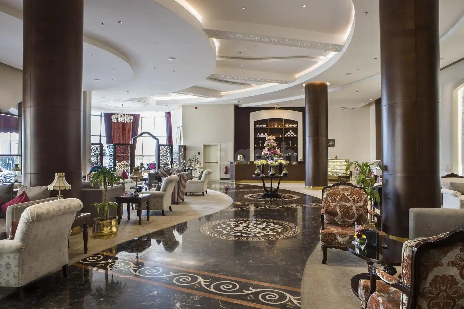 Lobby at Crowne Plaza Riyadh Al Waha, Riyadh, with polished marble floors and ornate ceiling moldings