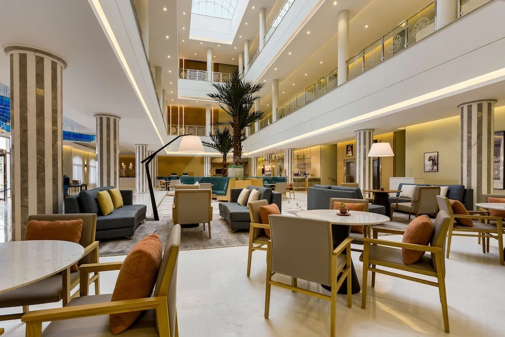 Lobby at Radisson Hotel Riyadh Airport, Riyadh, with marble floors and tall striped columns