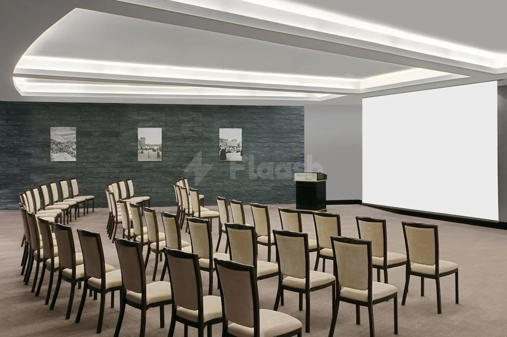 Conference room at Four Points by Sheraton Riyadh Khaldia, Riyadh, with rows of chairs facing a large screen