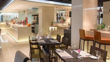 Lobby dining area at Narci­ssus Hotel & Resi­dence Ri­yadh, Ri­yadh, with mod­ern