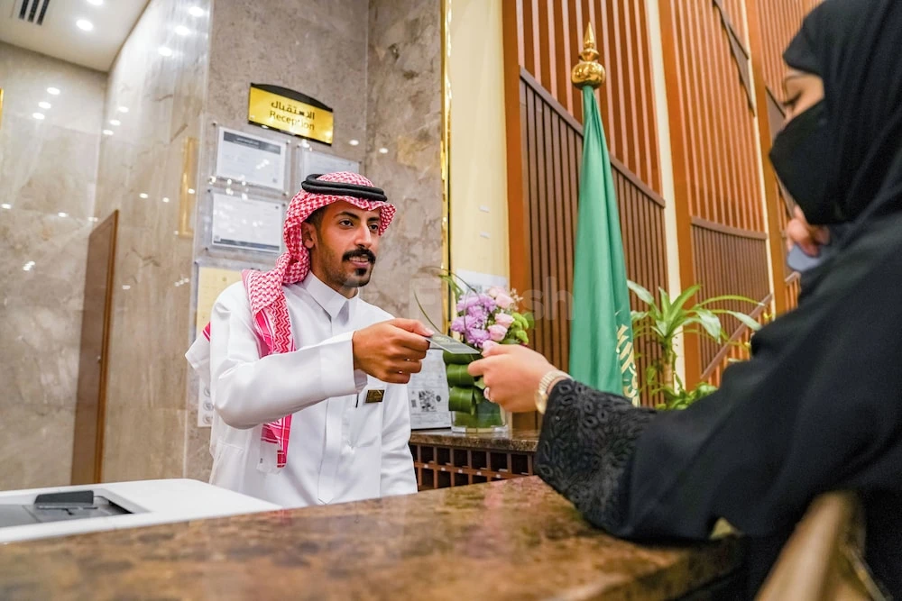 Reception area at Emaar Elite Makkah Hotel, Makkah, with marble walls and golden accents