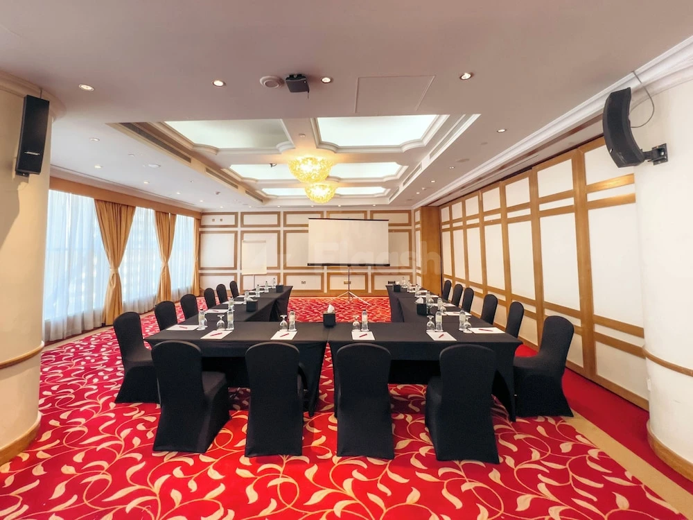 Conference room at Millennium Downtown Abu Dhabi, Abu Dhabi, with red patterned carpet and wooden paneling