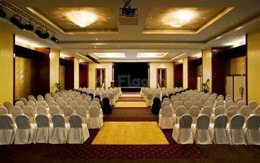 Ballroom at Le Méridien Al Aqah Beach Resort, Fujairah, with rows of white chairs and a central