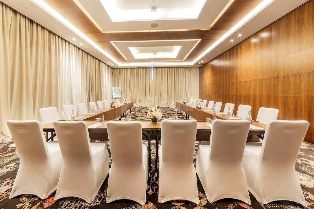 Conference room at Radisson Resort Ras Al Khaimah Marjan Island, Ras Al-Khaimah, with wooden paneling and recessed ceiling