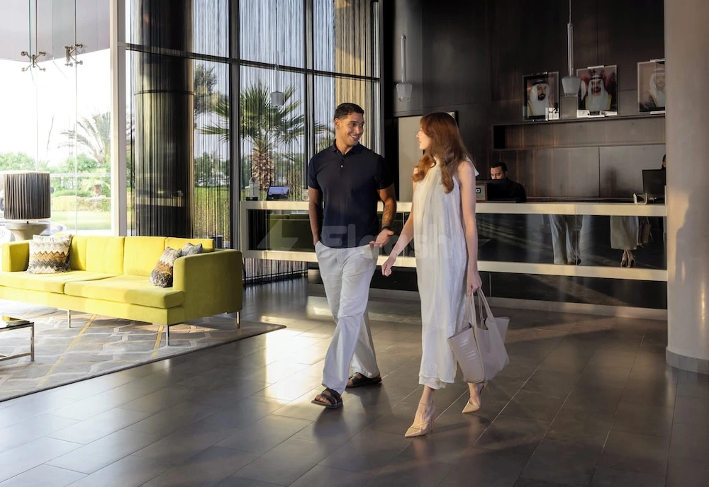 Lobby at Centro Sharjah, Sharjah, featuring a vibrant yellow sofa and large glass windows