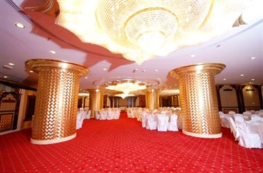 Ballroom atoriously at Al Bust100, Sharjah, with golden pillars and red carpet flooring