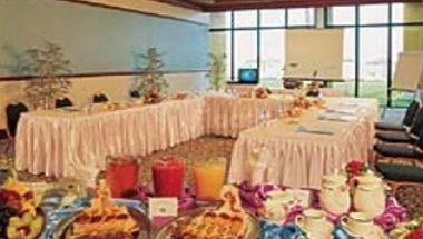 Banquet hall at Lou Lou’a Beach Resort, Sharjah, with pink tablecloths and festive centerpieces