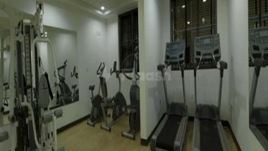 Fitness center at City Tower Hotel, Fujairah, with treadmills and weight machines visible