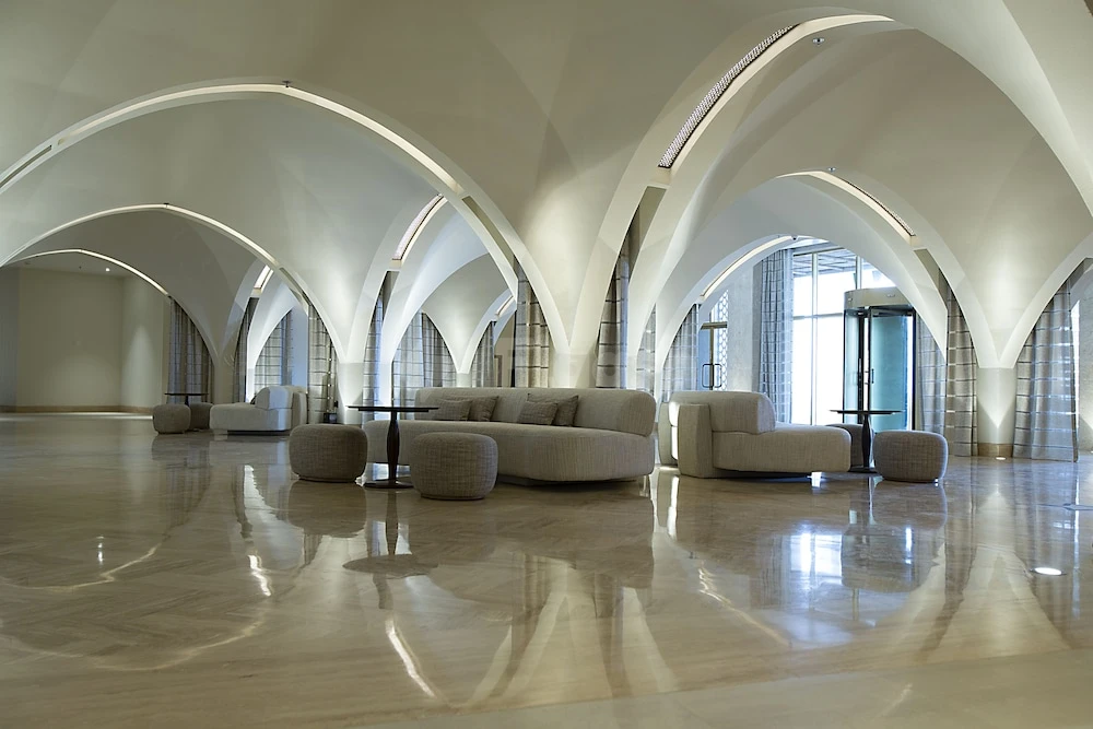 Grand hall at Liwa Hotel, Abu Dhabi, with arched ceilings and polished marble floors