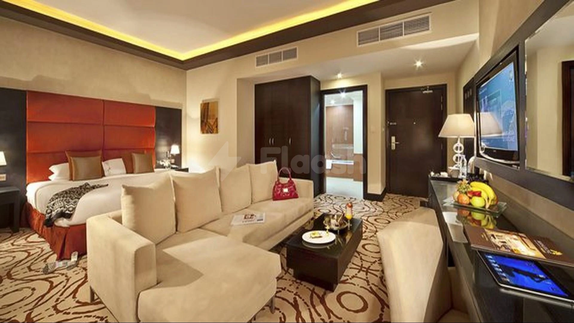 Luxury suite at Mangrove Hotel6 Hotel, Ras 375, Ras Al Khaimah, featuring red headboard and patterned carpeting