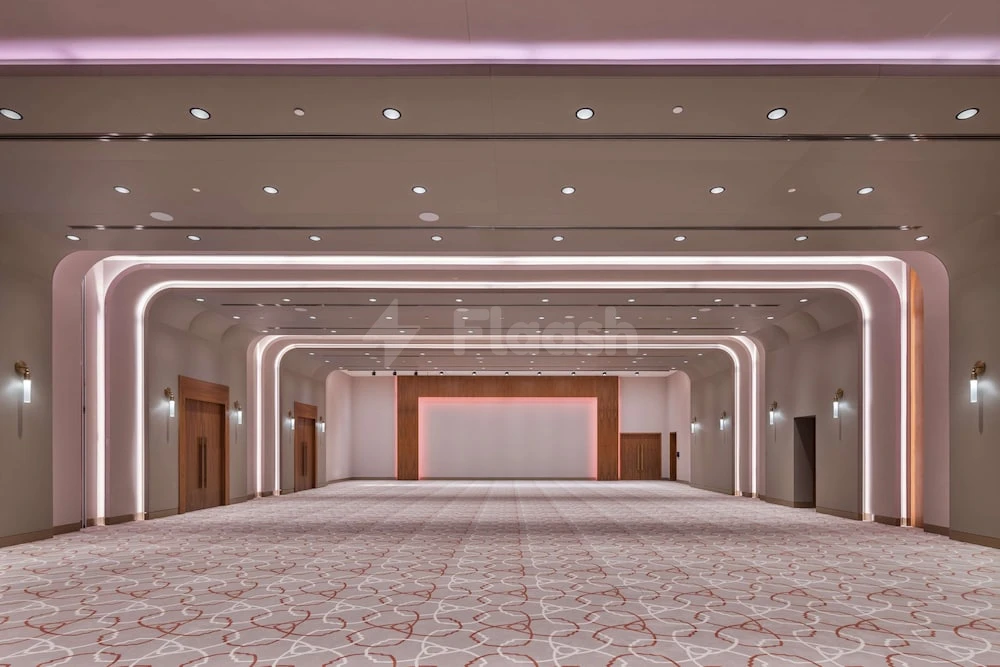 Grand ballroom at The WB Abu Dhabi, Curio Collection by Hilton, Abu Dhabi, featuring pink ambient lighting