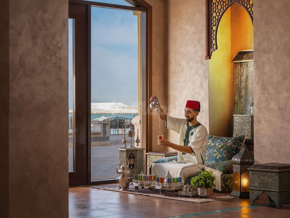 Lounge at Pullman Resort Al Marjan Island, Ras Al-Khaimah, with arched alcove and sea-view terrace