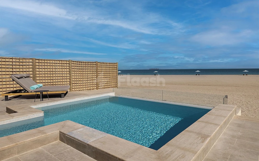 Private pool at Anant!tara Sir Bani Yas Island Al Yamm Villa Resort, Abu Dhabi, with beach umbrellas