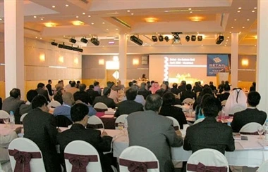 Meeting space at Expo Centre Sharjah, Sharjah, with attendees seated facing a presentation stage. lifestyle