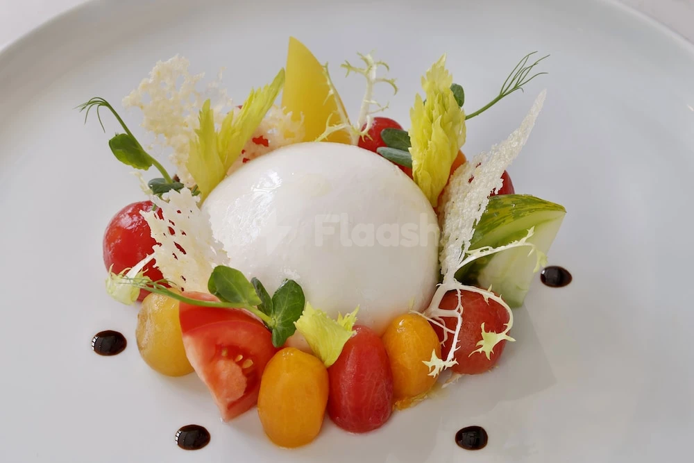 Dessert plate at DoubleTree by Hilton Abu Dhabi Yas Island Residences, Abu Dhabi, featuring burrata cheese, cherry tomatoes