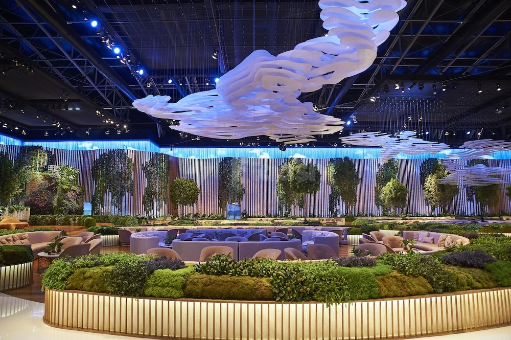 Lobby at InterContinental Dubai Festival City, Dubai, featuring cloud-like ceiling sculptures and lush greenery walls